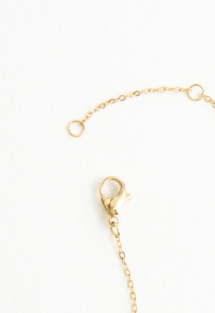 Shimmering Cross Necklace in Gold