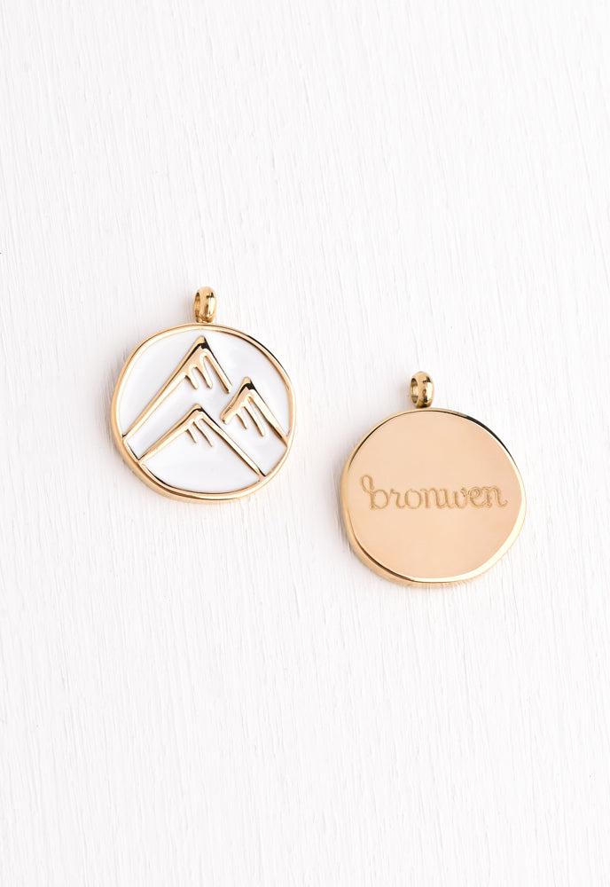 White enamel pendant with a Triple Mountain pendant