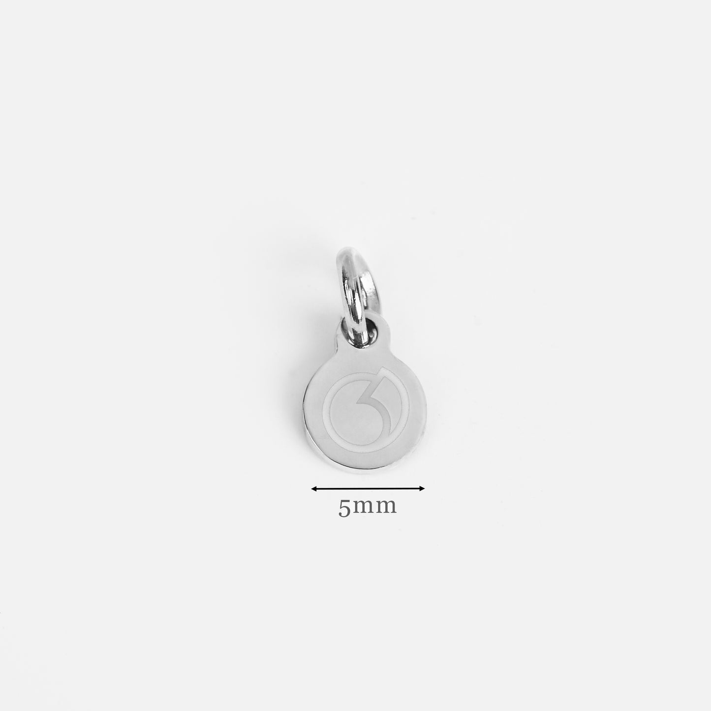 Silver circular logo tags