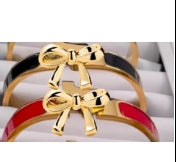 Bracelet with Bow Closure 1 in Black and Gold 1 in Burnt Orange and Gold