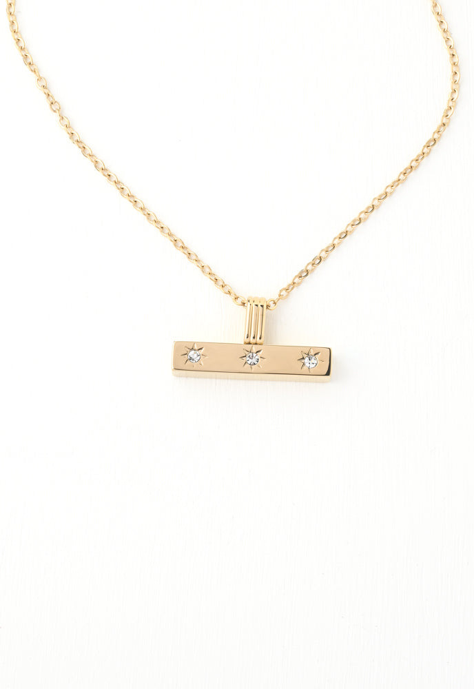 Bar necklace with 3 sun crystals etched in the gold