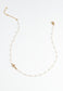 Floating cross, o-centered on chain with loosely spaced pearls necklace